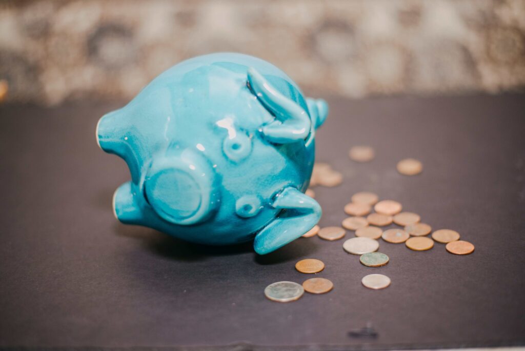a-piggy-bank-and-coins-on-a-table