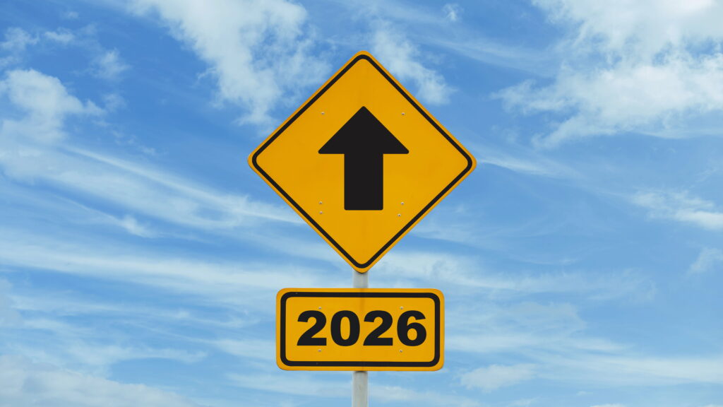 yellow roadsign pointing to 2026