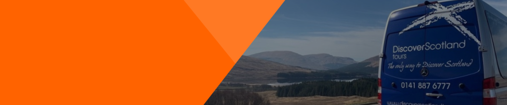 A banner of a Discover Scotland Van parked on a scenic road