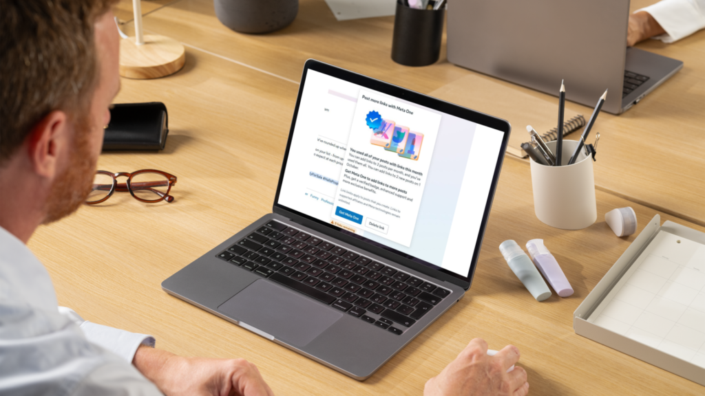 Business owner viewing a Meta subscription notification on a laptop, highlighting changes to Facebook's external link posting limits.